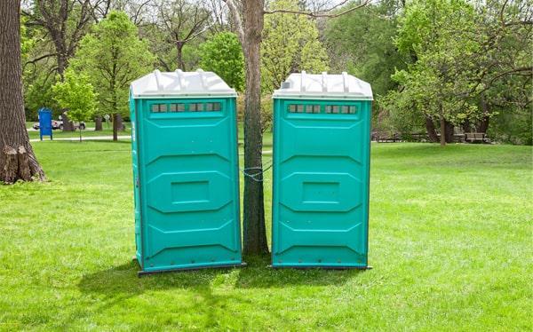 Clean portable restrooms arranged for a corporate outdoor event