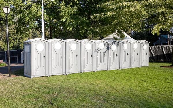 ADA compliant wheelchair accessible portable restroom with grab bars