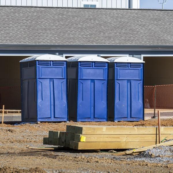 Portable toilet on an active construction job site